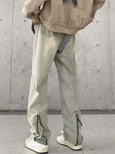 Men’s wide leg light-wash denim jeans with zipper details at the ankles designed for plus size comfort