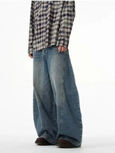 Men’s full size wide leg jeans in medium-wash blue denim with subtle fading and distressed details