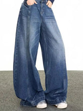 Men’s full size wide leg jeans in medium wash blue denim with classic stitching and a relaxed fit wide leg design