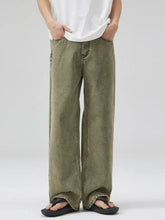 Men’s full size wide leg jeans in olive green with premium cotton, relaxed faded wash and raw hem detail