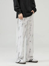 Men’s full size wide leg jeans in distressed white and gray tie-dye pattern made of denim with wide leg design