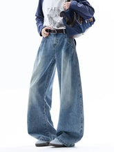 Men’s full size wide leg jeans in medium-wash blue denim with classic stitching and slightly stretchy fabric
