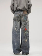 Men’s full size wide leg washed blue denim jeans with distressed patches chain embellishments and red heart design