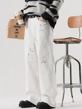 Men’s plus size white wide leg jeans in premium cotton with colorful paint splatter details