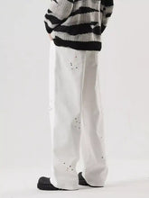 Men’s full size wide leg jeans in plus size premium cotton with white fabric and black splatter paint accents