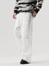 Men’s plus size wide leg white jeans with green and red paint splatters made from premium cotton