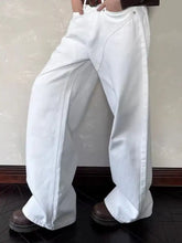 Men’s full size white wide leg denim jeans with relaxed tapered fit and visible stitching details