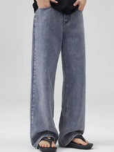Men’s full size wide leg jeans plus size in faded blue denim with rolled cuffs for comfortable leg jeans plus fit