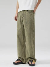Men’s olive green wide leg jeans in premium cotton with relaxed faded wash and visible stitching details plus size