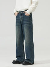 Men’s full size wide leg jeans in dark-wash denim with a relaxed straight-leg cut and subtle thigh fading