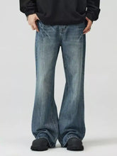 Men’s full size wide leg jeans in faded medium-blue denim with subtle distressing and frayed hems for a perfect fit