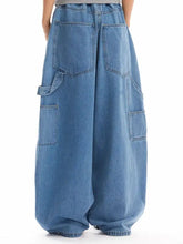 Men’s full size wide-leg jeans in medium-wash blue denim with cargo pockets and elastic waistband size wide leg