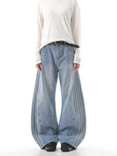 Men’s light-wash denim wide leg jeans with vertical side stripes and a relaxed silhouette plus size fit