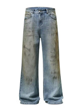 Men’s full size wide leg relaxed fit distressed denim jeans with faded blue and brown wash and subtle fading patterns