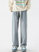 Men’s light-wash denim jogger pants with relaxed fit white drawstring waistband vintage wash jeans plus size
