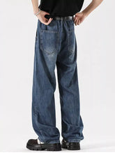 Men’s full size wide leg vintage wash dark blue denim jeans with relaxed fit and classic back pockets shown from the back