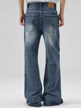 Men’s full size blue denim wash jeans with a relaxed fit wide-leg jeans design and faded wash finish