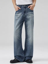 Men’s full size wide-leg jeans in faded blue wash denim with subtle whiskering and a relaxed fit design