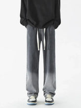 Men’s full size wide leg washed denim jeans in gray gradient with white drawstrings for comfortable fit