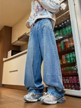 Men’s full size wide leg jeans offer a light-wash denim with a relaxed cut and detailed stitching in a washed finish