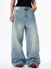 Men’s full size wide leg washed jeans in light-wash denim with a relaxed high-rise fit and subtle fading for casual wear