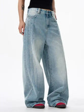 Men’s full size wide leg washed light-wash denim jeans with high-rise relaxed fit and subtle fading for casual wear