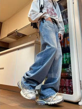 Men’s full size wide leg washed jeans offer a relaxed fit with light-wash denim and visible stitching details