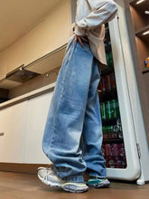 Men’s full size wide leg washed jeans offer a relaxed fit in light-wash denim with a wide-leg washed finish