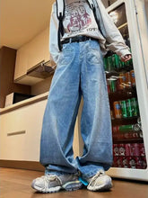 Men’s full size wide leg washed jeans offer a relaxed fit in light-wash blue denim with visible stitching details