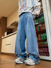 Men’s full size wide leg jeans offer a relaxed fit with a washed finish light-wash blue denim and rolled cuffs