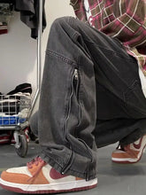 Men’s dark gray denim relaxed fit jeans with full size zipper detail along the side seam for plus size fit jeans