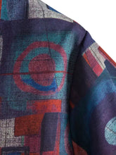 Mens geometric short sleeve button down shirt with blue and purple abstract patterned scarf featuring geometric shapes