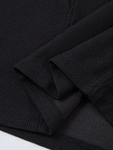 Mens henley structured black waffle knit short sleeve shirt with textured fabric, ribbed cuffs and hem