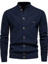 Mens long sleeve cardigan in navy blue with gold buttons and moderate stretch
