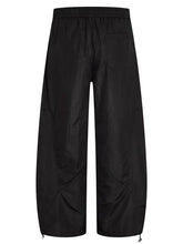 Mens loose fit drawstring cargo pants in black with adjustable cuffs