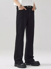Men’s loose fit jeans in black with straight-leg cut and subtle stitching details for a sleek modern look
