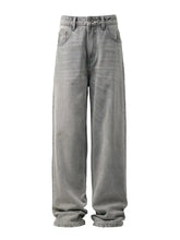 Men’s loose fit wash jeans in faded gray wide-leg denim with classic stitching and button fly closure