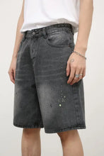 Mens mid rise denim shorts in basic style with gray paint splatters