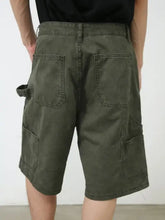 Mens mid rise denim shorts in olive green with cargo utility loop