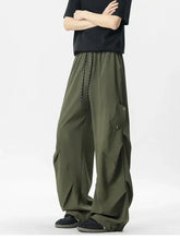 Mens oversized wide leg cargo pants in olive green with drawstring