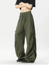 Mens oversized wide leg cargo pants in olive green with drawstring