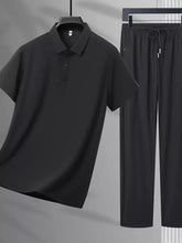 Men’s plus size black short-sleeved polo shirt with button detail and classic collar, paired with matching pants set