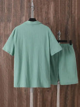 Men’s plus size button up short sleeve shirt and shorts set in mint green textured weave shown with measuring tape