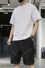 Men’s plus size black shorts with white stitching accents in a slightly stretchy fabric machine wash cold friendly
