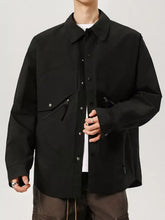 Men’s plus size casual black utility-style jacket with button closures and zippered pockets for everyday wear