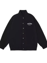 Men’s plus size black varsity jacket with white embroidered nothing to say text and silver snap buttons down front