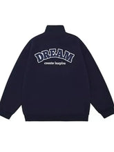 Back view of navy blue men’s plus size casual varsity jacket with dream and create inspire embroidered in white lettering