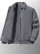 Men’s plus size gray corduroy sherpa lined winter jacket with plush fleece lining and black and white patch on pocket