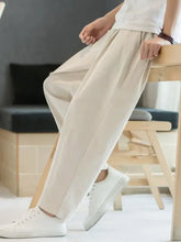 Mens plus size cropped straight pants in relaxed beige linen with white sneakers