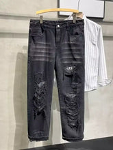 Men’s plus size black distressed slim fit jeans with ripped and frayed details on thighs in denim material